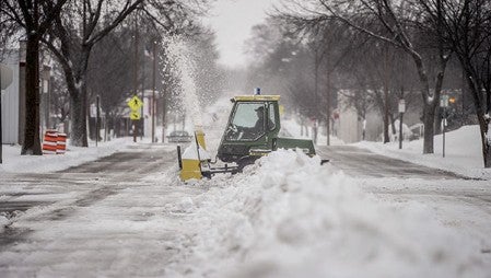 A snowblower clears a path through the gathered snow in the middle of Second Street NE Thursday morning as last night’s storm moved out of the region. Austin received between 7 and 10 inches of snow. Eric Johnson/photodesk@austindailyherald.com