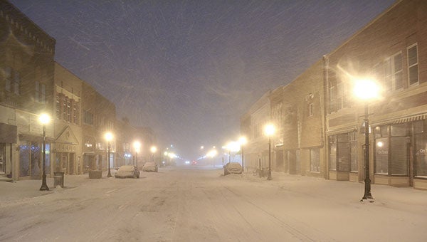 A shot of Main Street looking north at about 5:30 a.m. The plows were just getting out, but there were substantial drifts on the sidewalks and around the sides of the buildings. Photo provided by Matt Freechack