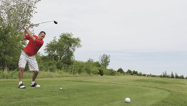 Tom Klapperick tees off during the Dave “Tolly” Tollefson Cancer Research Memorial Golf Outing at Meadow Greens in 2014. Meadow Greens owner Mike Grinstead recently bought the former Ramsey portion of his course. Herald file photo