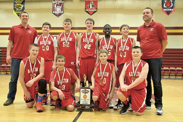 The Austin seventh grade boys basketball A team took third in the state tournament March 13. Austin beat East Ridge 41-28 in the third place game, it also beat Minnetonka 50-40 and it beat Stillwater 54-28. Austin’s lone loss was to Prior Lake by a score of 37-35. Back row (left to right): coach Dave Dahlstrom, Logan O’Rourke, Braden Greibrok, Ethan Owens, Okey Okey, Jordan Ransom and coach Matt Thimjon; front: Teyghan Hovland, Casey Berg, Ian Bundy and Ryan Mead. Photo Provided