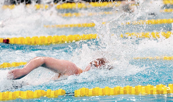 Austin’s Isaac Christopherson swims in the Class A state preliminaries at the University of Minnesota Aquatic Center in Minneapolis Friday. Adam Holt/Faribault Daily News
