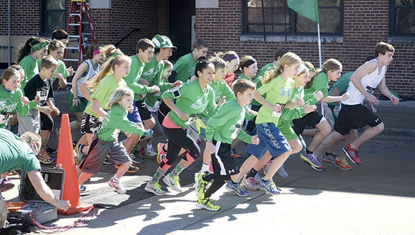 People of all ages take off at the beginning of the first Shamrockin’ 5K Run/Walk last year. Herald file photo