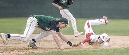 Austin’s Ryan McCormack just gets back to first before the tag of Rochester Mayo’s Mitchell McCarty during game one of a doubleheader at Dick Seltz Field Thursday night. Eric Johnson/photodesk@austindailyherald.com