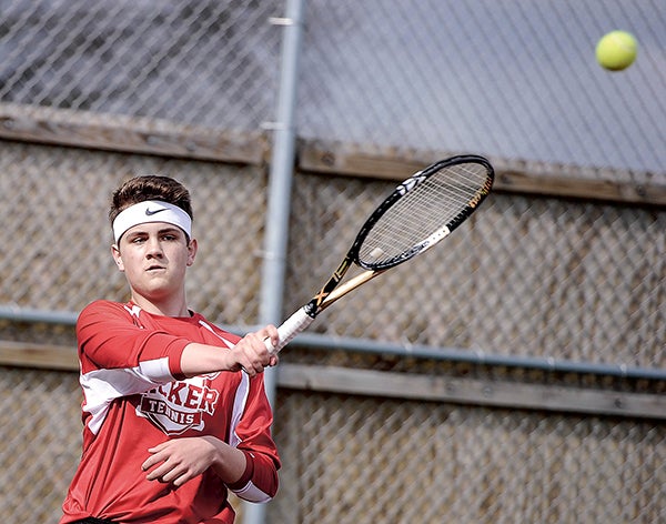 Joe Knorr returns a shot at No. 3 singles against Red Wing Thursday afternoon. Eric Johnson/photodesk@austindailyherald.com