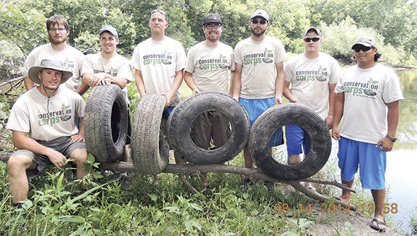 A photo from 2014 showing a Conservation Corps of Minnesota crew that helped with the CRWD’s tire-removal initiative as part of the local Adopt-A-River program. At that time, more than 1,100 tires had been removed since 2011 from the Cedar River in Mower County. Photo provided