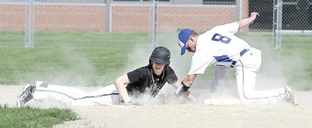 Blooming Prairie’s Seth Peterson gets back to second base just before the tag of Hayfield’s Jake Olive Friday afternoon in Blooming Prairie. Eric Johnson/photodesk@austindailyherald.com