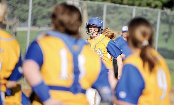 Hayfield’s Kate Kruger smiles as she trots home after her three-run homerun against Janesville-Waldorf-Pemberton in their Section 1A West tournament game. Eric Johnson/photodesk@austindailyherald.com