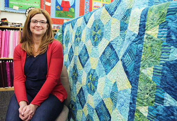 Jessica Steinbach of Austin, an employee at Calico Hutch Quilt Shop in Hayward, designed this quilt that is featured in the spring/summer issue of Quilt Sampler magazine. The magazine has a multiple-page spread about Steinbach’s project and Calico Hutch. Sarah Stultz/Albert Lea Tribune