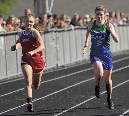 Lyle-Pacelli’s Rachel Nelson, right, and GMLOK’s Katelyn Luthe run down the stretch at the SEC meet in Grand Meadow Tuesday. Photo provided by Coleen Nelson