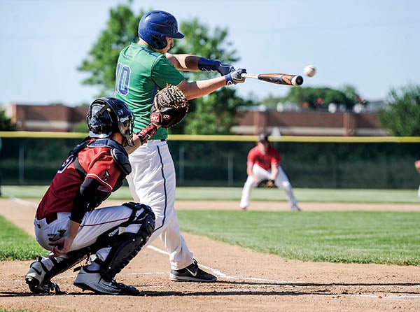 Lyle-Pacelli’s Lee Bauer connects for a triple against United South Central in the Section 1A West Tournament Thurdsay at Riverland Community College. Eric Johnson/photdoesk@austindailyherald.com