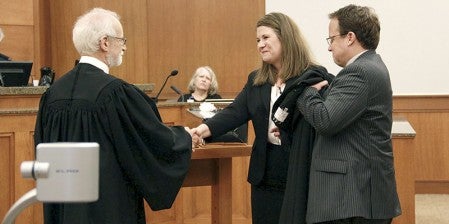 Judge Christa Daily shakes Senior Judge Robert Birnbaum’s hand after she’s sworn in as the newest Third Judicial District judge on Friday in the Mower County Jail and Justice Center. Jason Schoonover/jason.schoonover@austindailyherald.com