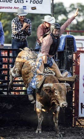 Jacob Stark kicks off the Great Frontier Bull Riding show last year at the grandstand during the Mower County Fair. Herald file photo