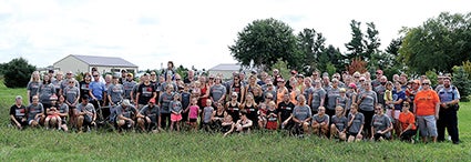 Supporters come together for a group picture prior to making the 300M4FREEDOM end run Sunday.