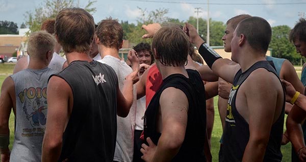 The LeRoy-Ostrander football team huddles after practice in LeRoy recently. Rocky Hulne/sports@austindailyherald.com