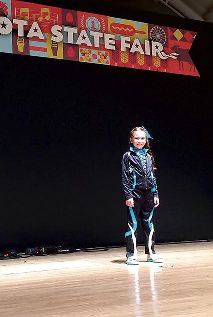 Alex Goetz stands on the talent show stage at the Minnesota State Fair, where she placed third in the preteen division. Photo provided