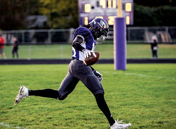 Grand Meadow’s Wes Ojulu coasts into the endzone for the first score of the night against Alden-Conger/Glenville-Emmons in Grand Meadow Friday night. Eric Johnson/photodesk@austindailyherald.com