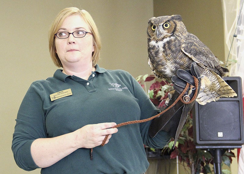 Zoomobile Naturalist Chris Ness listens to a question from the audience  as she holds an owl nicknamed Cricke during stop by Minnesota Zoo leaders at the Mower County Senior Center on Monday. Jason.schoonover@austindailyherald.com