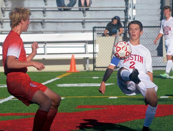 Tucker Nelson controls the ball for Austin against Mankato West in Art Hass Stadium Thursday. Rocky Hulne/sports@austindailyherald.com
