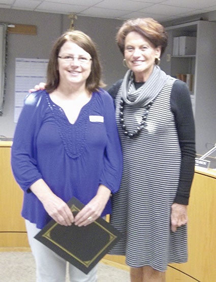 25 years of service. Pictured left to right: Sharon Schnieder and Commissioner Glynn. Not pictured:  Tammy Corey. 