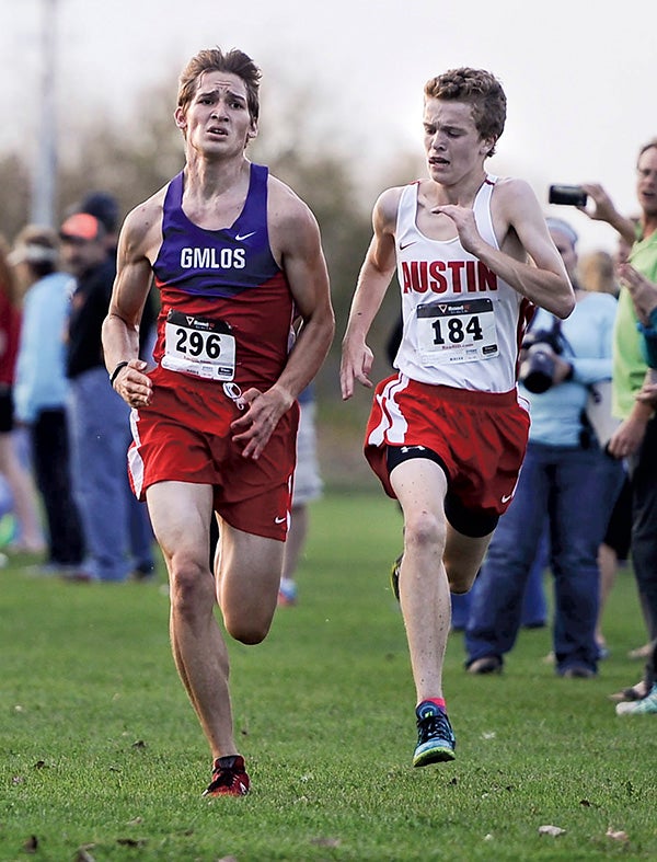 Grand Meadow/LeRoy-Ostrander/Southland’s Peter Torkelson, left, and Austin’s Henry Hinchcliffe race to the finish line during the Austin Invite Tuesday afternoon. Eric Johnson/photodesk@austindailyherald.com