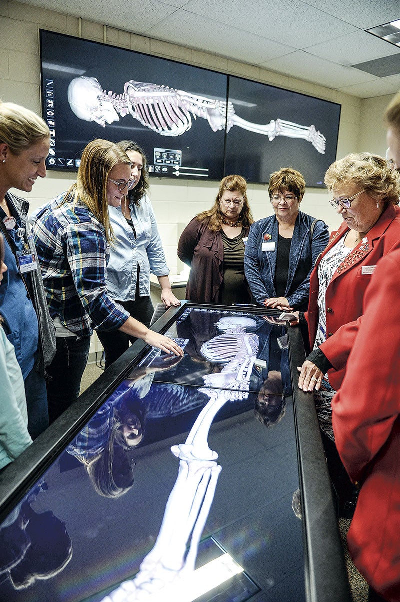 Christi Rohlfing demonstrates the Anatomage table Thursday afternoon at Riverland Community College.  Eric Johnson/photodesk@austindailyherald.com