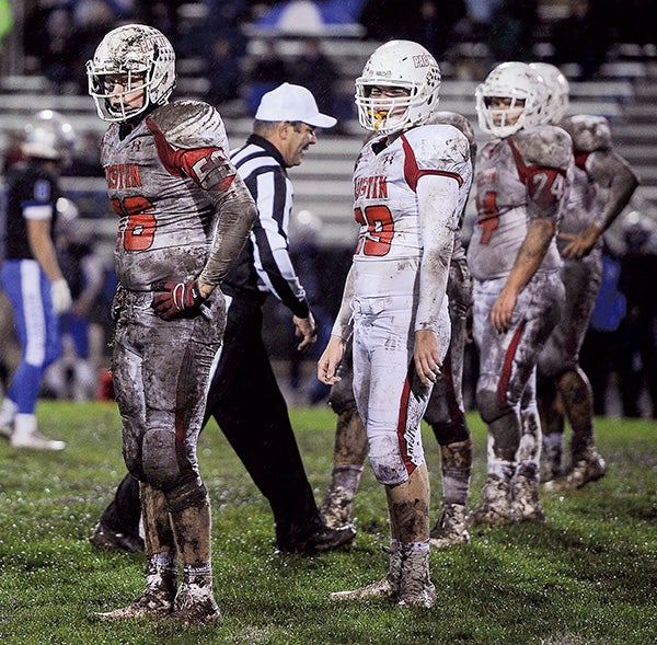 Austin’s Kyle Oberbroeckling, left, and the Packers D waits for call from the sideslines in the fourth quarter of their Section 1AAAAA semifinal game Saturday in Owatonna. Eric Johnson/photodesk@austindailyherald.com