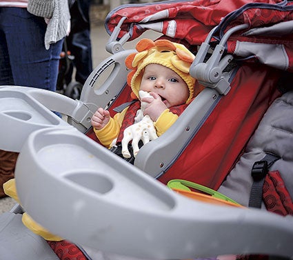 Jonah Korfhage is wrapped up in the spirit of Halloween Saturday during the fourth annual Fun Fest, held downtown.