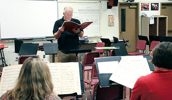 ASO conductor Stephen Ramsey looks through the music during rehearsal at the Austin High School annex. Photo provided