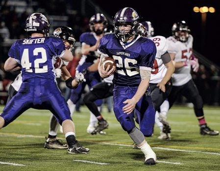 Grand Meadow’s Christophor Bain carries in the third quarter against Spring Grove in Section 1 Nine Man championship Friday night at Rochester Community and Technical College. Eric Johnson/photodesk@austindailyherald.com