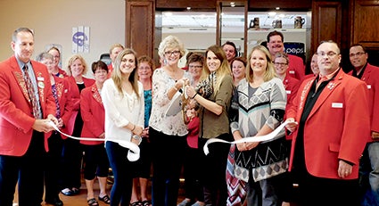 NEW PUB. Primrose Retirement Community invited Chamber Ambassadors for a ribbon cutting, noting the opening of the facility’s new Primrose Pub. Primrose staff, pictured at center, were from left, Director of Nursing Lexy Smith, Executive Director Annette Ross, Sales Director Rebecca Earl, and Life Enrichment Coordinator Sophia Morse. Photo provided