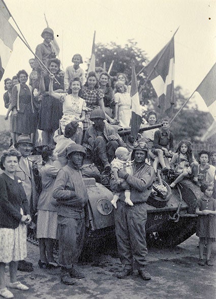 The liberation of France came in 1944. Here, the women of Guignicourt celebrate their arrival. Nelly Croes is in the photograph but is in the back and cannot easily be seen. She was saddened to hear that the soldiers pictured here, later died in a confrontation with German soldiers. Photo provided.