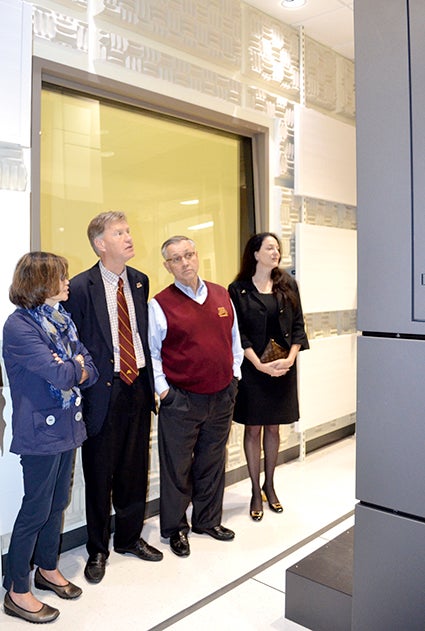 Regents take a first look at the huge cryo-electron microscope at The Hormel Institute on Wednesday. From left, Peggy Lucas of Minneapolis, Thomas Anderson of Alexandria, Chairman Dean Johnson of Willmar, and Tracey Curran, wife of Brian Herman, Vice President for Rearch at the University of Minnesota. 