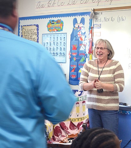 Banfield Elementary School fourth grade teacher Marsha Wilson laughs in surprise as she is presented the 2017 Austin Public Schools Teacher of the Year Award Wednesday by Teacher of the Year Committee Chairman, David Brown. 