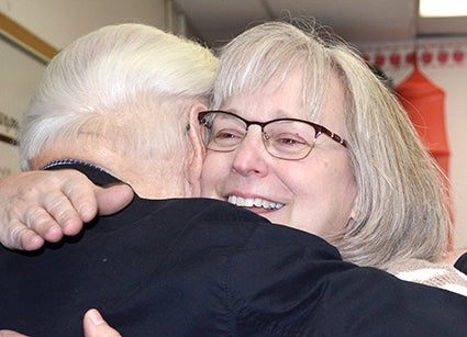 Marsha Wilson yes a hug from her dad, Erling Opsahl, just after being named Austin's Teacher of the Year for 2017. The presentation was made Wednesday at Banfield Elementary School, where Opsahl is a fourth grade teacher. 