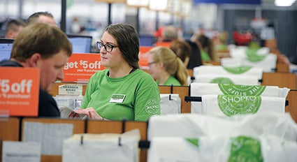 Shopko cashier Maddie Brown works Black Friday hours at Shopko Thursday afternoon just after doors open. 