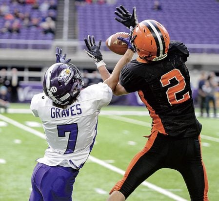 Grand Meadow’s Josh Graves breaks up a pass intended for Cleveland-Immanuel Lutheran’s Austin Plonsky in the second quarter of the Minnesota State Nine Man Prep Bowl Friday morning at U.S. Bank Stadium. Eric Johnson/photodesk@austindailyherald.com