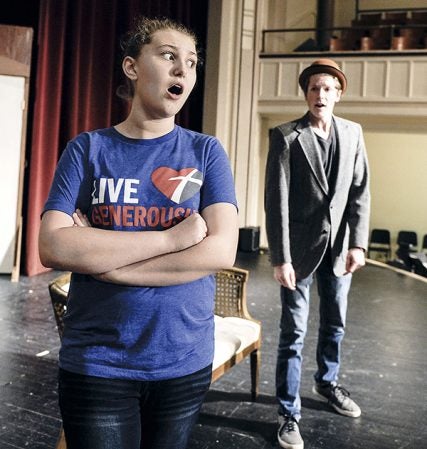 Katie Lillemon, playing Annebelle Click, rehearses a scene with Michael Petersen, playing Harry Witherspoon for the Austin High School play “Lucky Stiff.” Eric Johnson/photodesk@austindailyherald.com