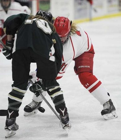 Austin’s Hannah McMasters fights for position on a face-off against Rochester Mayo in Riverside Arena Tuesday. Rocky Hulne/sports@austindailyherald.com