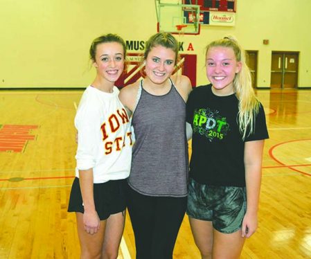 From left: McKenna Hotek, Madison Klein and Cloey Thorpe will lead the Austin Packer dance team as captains this season. Not pictured is captain Mary Willrodt. Rocky Hulne/sports@austindailyherald.com