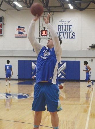 Kyler Paulson attempts a jump shot for the Blue Devils in practice recently. Rocky Hulne/sports@austindailyherald.com