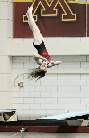Maddie Mullenbach dives in the Class A state swimming and diving meet in the University of Minnesota Aquatic Center in Minneapolis Friday. Adam Holt/Faribault Daily News