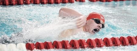 Isaac Christopherson swims in the 200 freestyle against Albert Lea Thursday night at Bud Higgins Pool. Eric Johnson/photodesk@austindailyherald.com