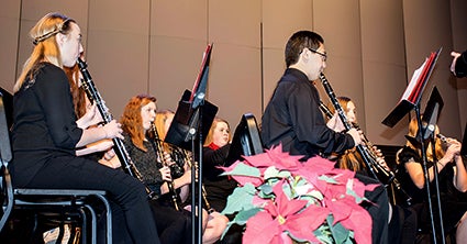Members of the Austin High School concert band perform during Monday’s holiday concert in Knowlton Auditorium. Jana Gray/jana.gray@austindailyherald.com