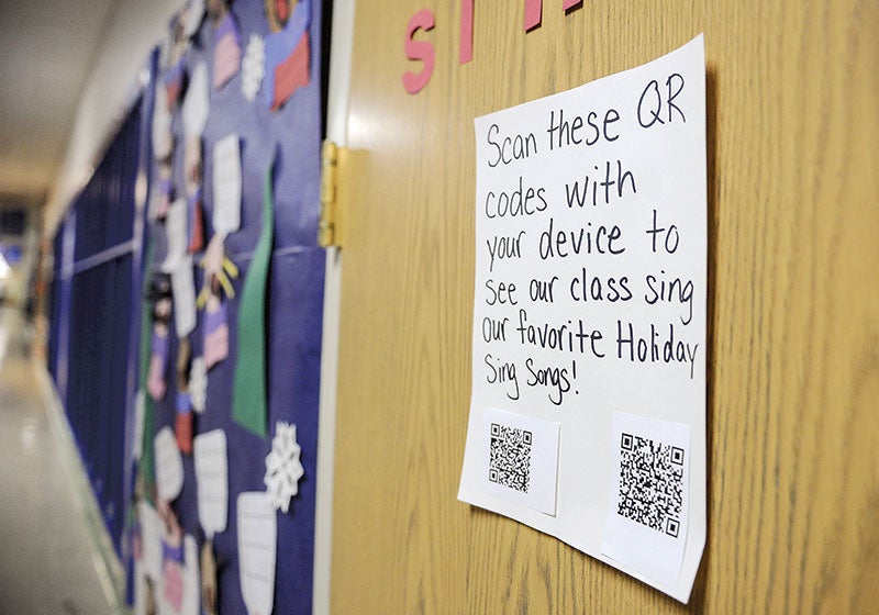 One of the doors featured scanable QR codes that would allow parents the chance to see their kids sing holiday songs from their cellphones. 
