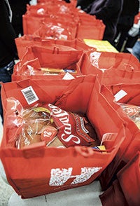 Bags of food wait to be picked up. 