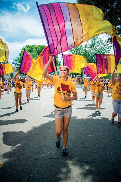 Bethany Rowbal marching with the University of Minnesota Color Guard. Gopher Photo/gopherphoto.com