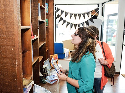 Michelle Boris, with her mom Judy, look through Minnesota books during a stop in Sweet Reads earlier this year.