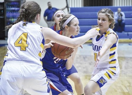 Southland’s Kaysie Allen is hounded by the defense of Hayfield Emily Sprau, left, and Emma Holst, right in Mayo Civic Center in Rochester Friday. Rocky Hulne/sports@austindailyherald.com