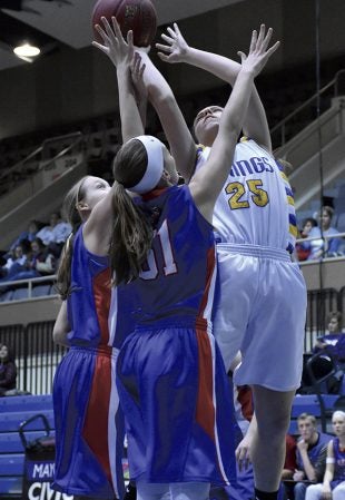 Hayfield’s Abby Stasko fights up a shot against Southland in Mayo Civic Center Friday. Rocky Hulne/sports@austindailyherald.com