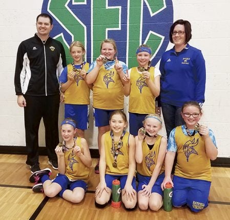 The Hayfield 5th grade girls basketball team went 3-0 to capture first place in the Lyle tournament Sunday.  Hayfield started with two pool play wins over St. Ansgar (25-16) and Albert Lea (22-13).  Hayfield matched up with Kasson-Mantorville in the championship game and won 28-6. Pictured: Back row: (left to right): Coach Kasey Krekling, Jacy Tufte, Sidney Anderson, Chelsea Christopherson, and and coach Christina Beaver; front row: Natalie Beaver, Jenna Klocke, Alexys Swygman, and Reese O'Malley. Photo Provided
